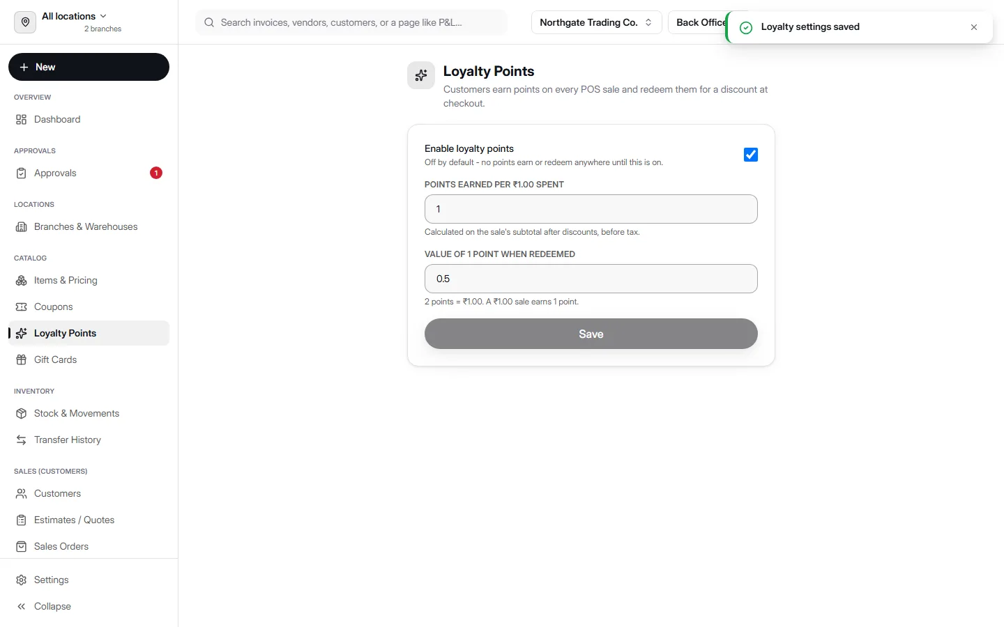 Loyalty Points settings screen in AccountDesq showing an enabled toggle, Points earned per ₹1.00 spent set to 1, Value of 1 point when redeemed set to 0.5, and a live helper line explaining the math